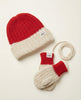 Red and beige knit hat and mittens set on a light background
